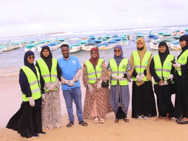 A group of SIADO volunteers and colleagues outside.